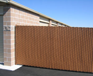 Vinyl Wood Chain Link Fence in a storage complex